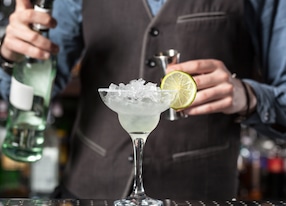 bartender prepping a margarita cocktail