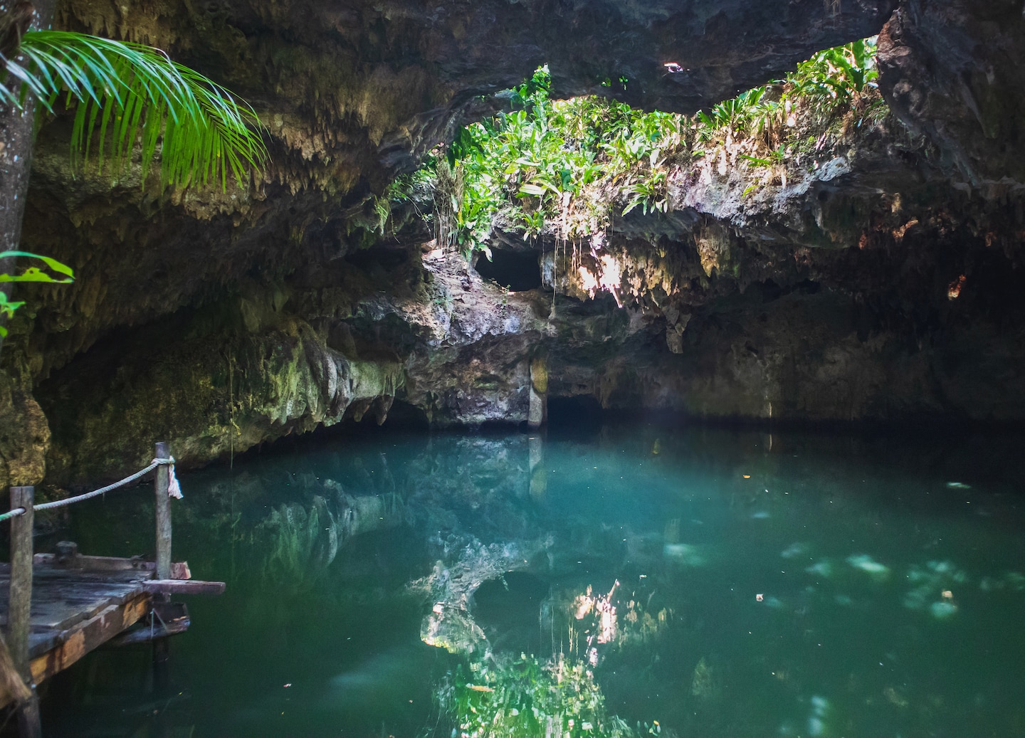 The Jade Cavern cenote adventure combines jungle rides, emerald swimming, limestone formations, and Mayan cultural insight. - Cozumel, Mexico