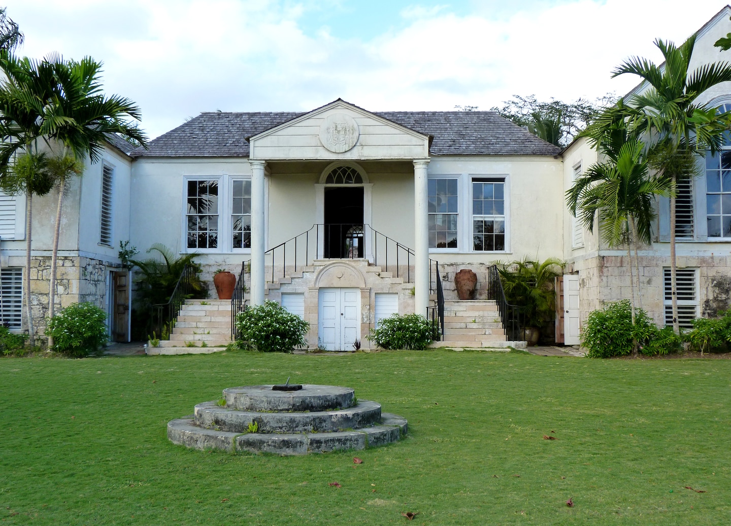 Historic Rose Hall Great House overlooks lush Jamaican landscape under bright sun. - Falmouth, Jamaica