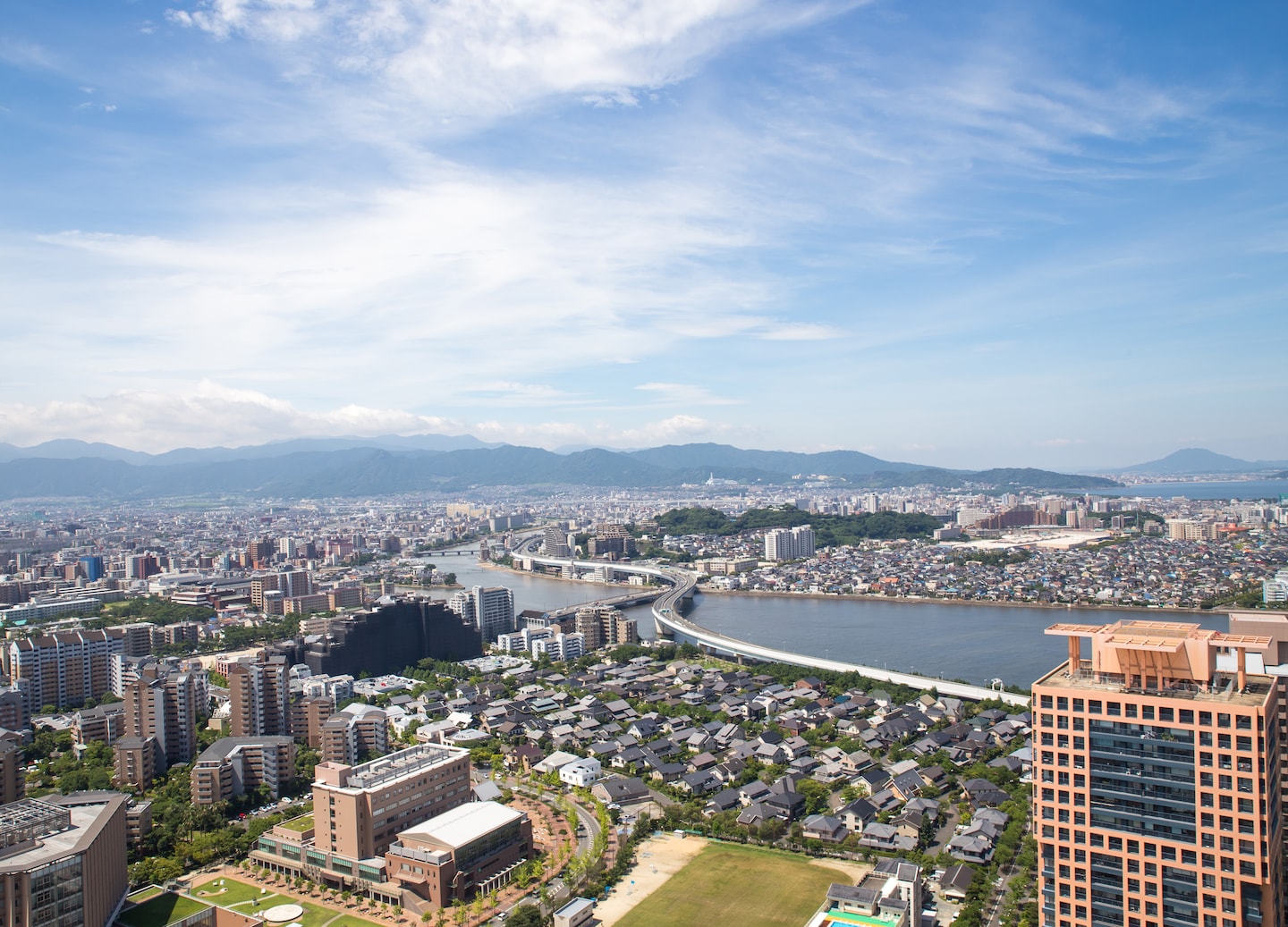 City skyline stretches toward the bay, viewed from Fukuoka Tower's heights. - Kumamoto, Japan