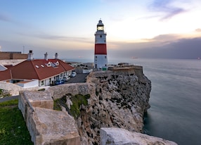 europa point lighthouse and rock of gibraltar during sunrise
