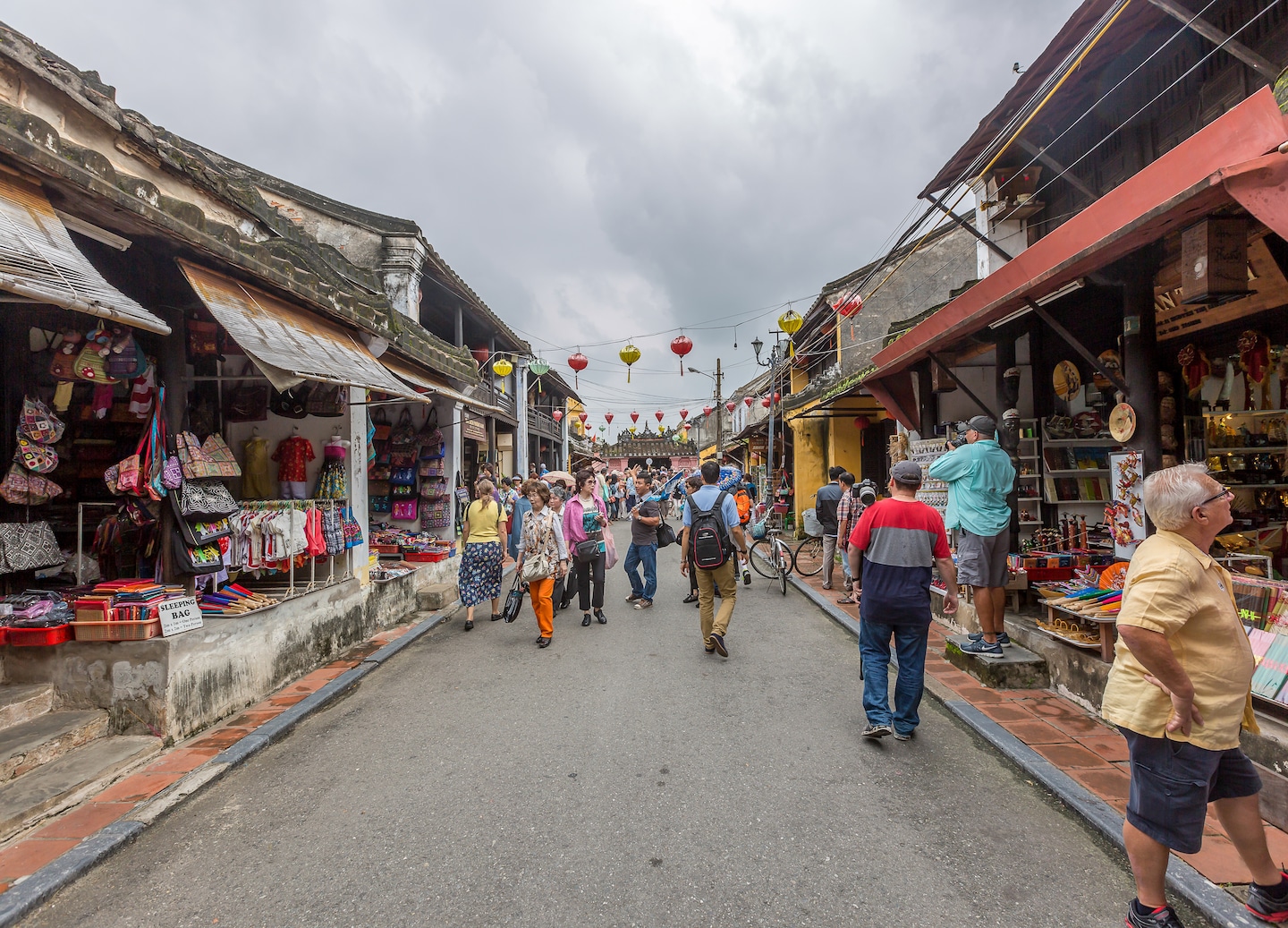 Vibrant produce fills Hoi An market stalls, showcasing the town’s daily life. - Hoi An, Vietnam