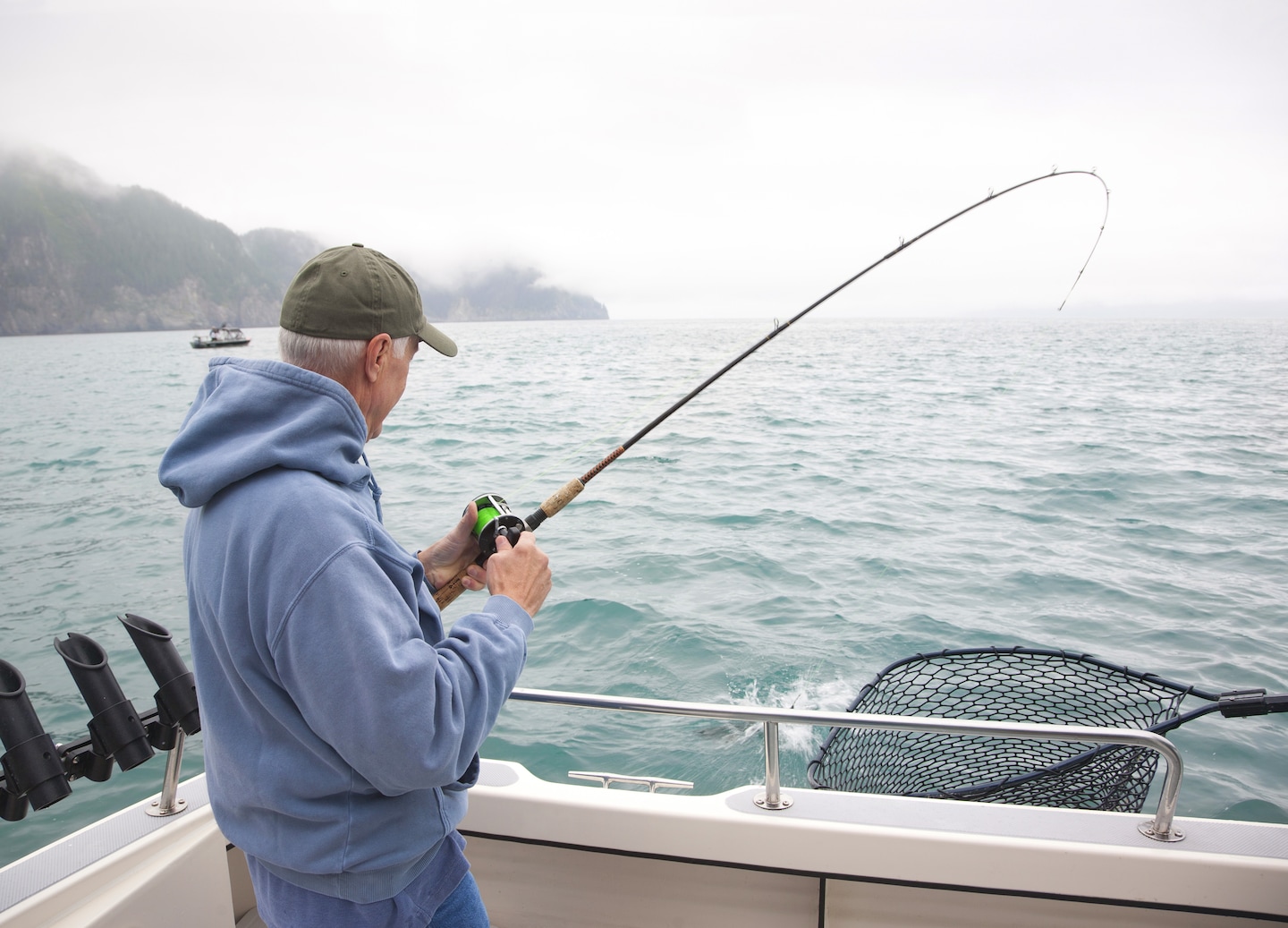 Angler casts from quiet Ketchikan waters. - Ketchikan, Alaska