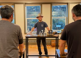 station one distillery and bottle infusion experience fireman bartender with cocktail display