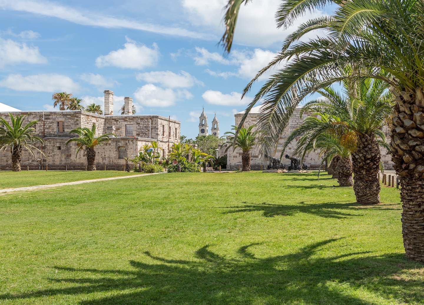 Historic waterfront buildings at Kings Wharf viewed from a scenic trolley route. - Royal Naval Dockyard, Bermuda