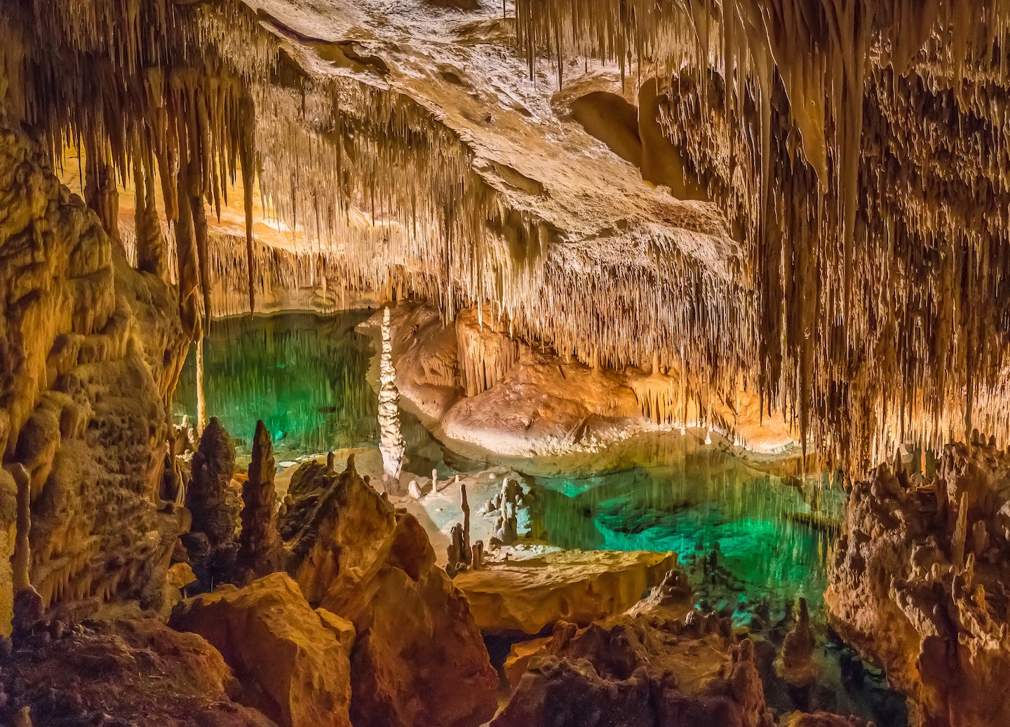 Explore Bermuda’s Crystal and Fantasy Caves, featuring glowing blue pools, stalactites and stalagmites underground. - Royal Naval Dockyard, Bermuda