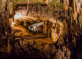 under the ground beautiful view of stalactites and stalagmites in an underground cavern postojna