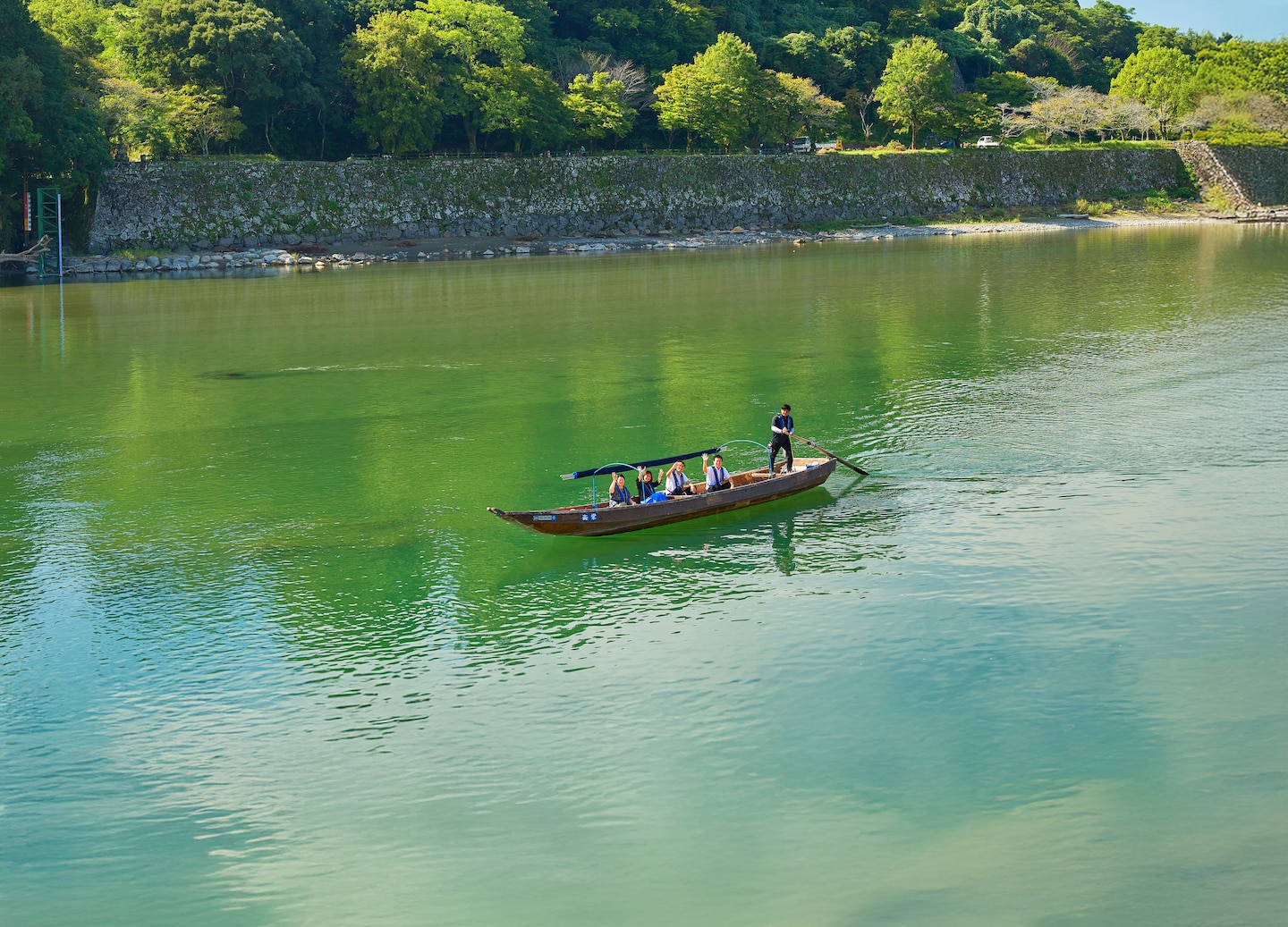 A canoe glides along the Kumagawa River. - Kumamoto, Japan