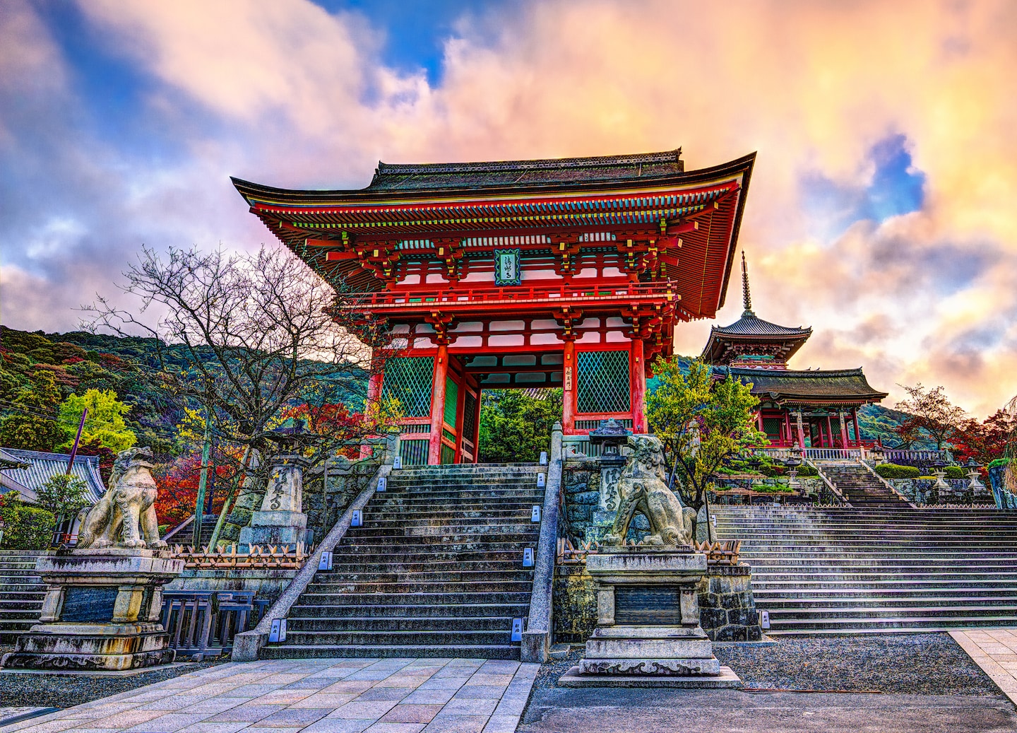 Kiyomizu‑dera’s bright temple gate stands over Kyoto under morning light. - Kyoto, Japan