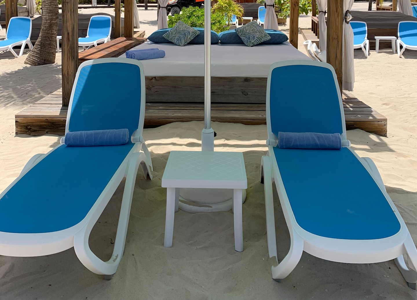 Relax on a private beach bed at Adrenaline Beach with ocean breezes, amenities and attentive service. - Labadee, Haiti