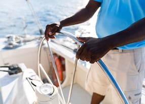 man sailing catamaran boat ocean