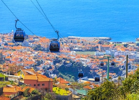 traditional cable car transporting tourists above funchal city of madeira island portugal