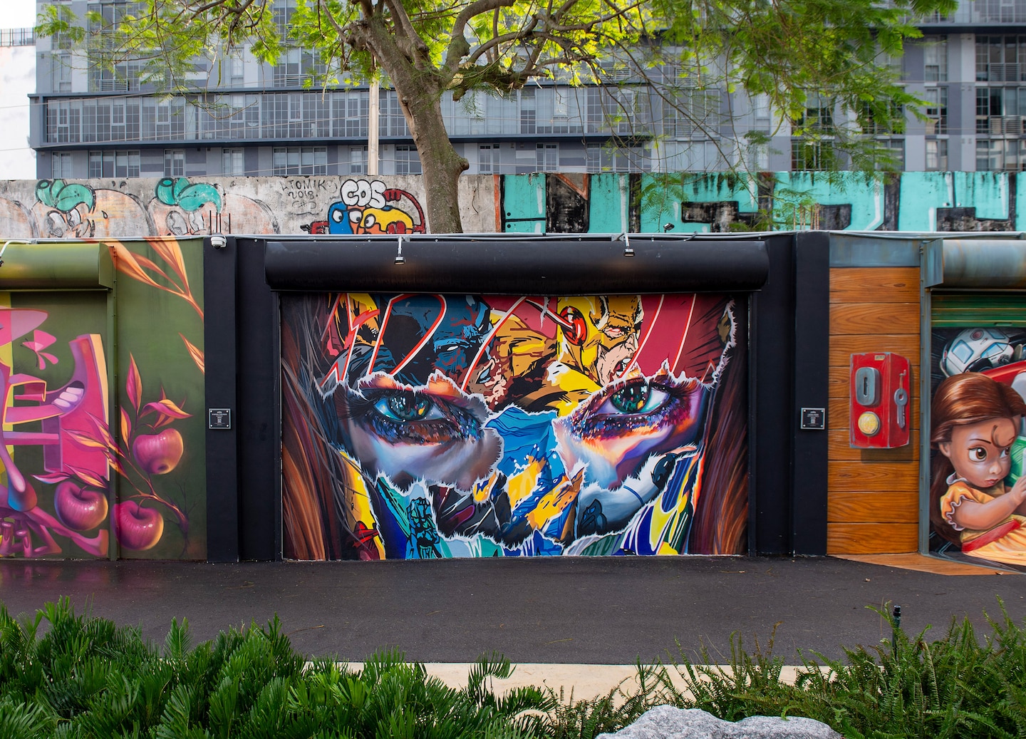 A vibrant superhero mural at Wynwood Walls during a guided street‑art tour. - Miami, Florida