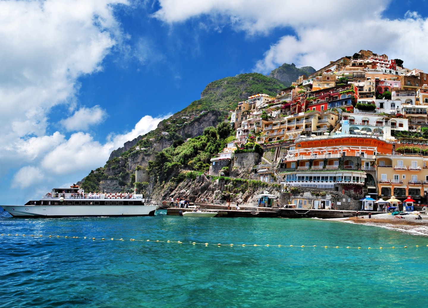 Positano’s pastel homes rise above the Amalfi Coast’s blue water and steep cliffs. - Amalfi Coast, Italy