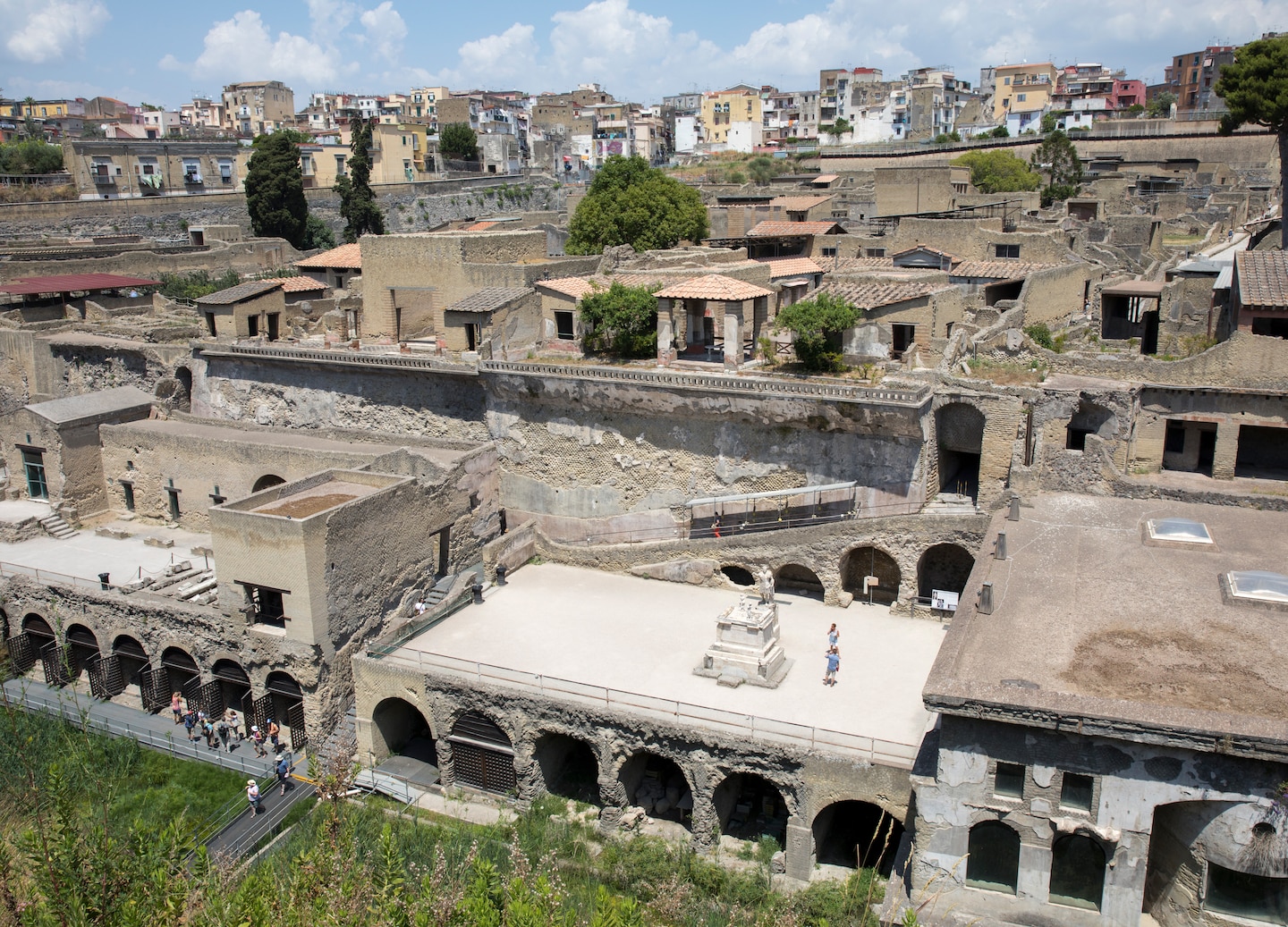 Ancient Herculaneum ruins show preserved stone walls and streets from the Roman seaside town. - Naples, Italy