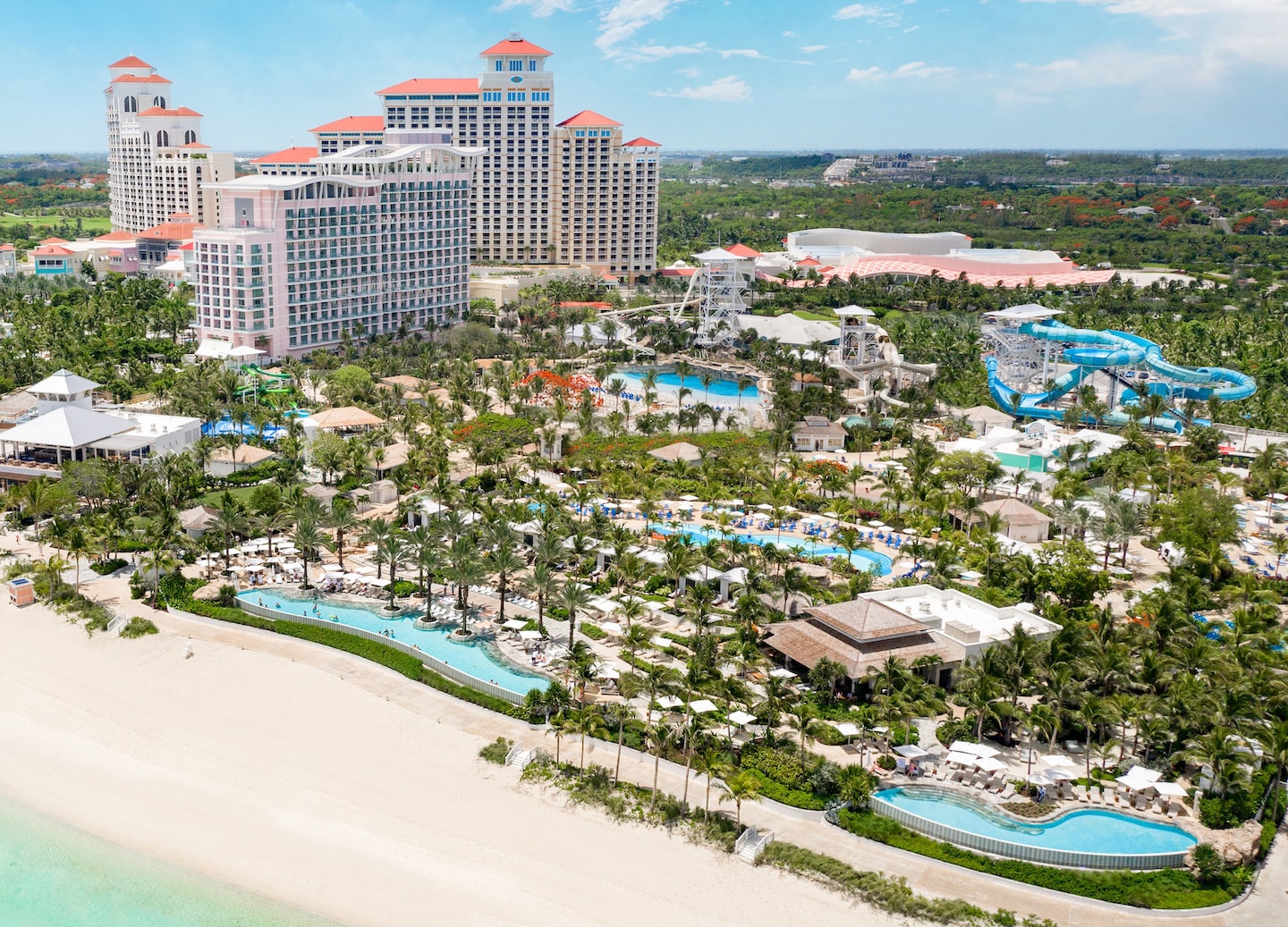 Aerial view of Baha Mar with turquoise pools, slides, and bright beachfront scenery. - Nassau, Bahamas