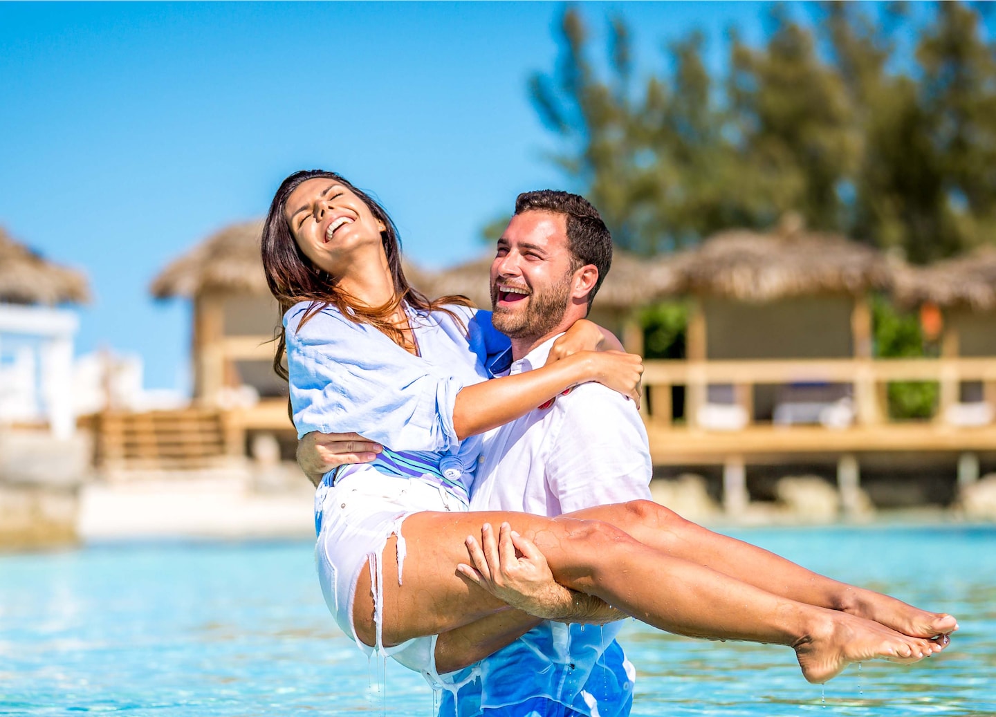 A couple relaxing in a pool. - Bahamas