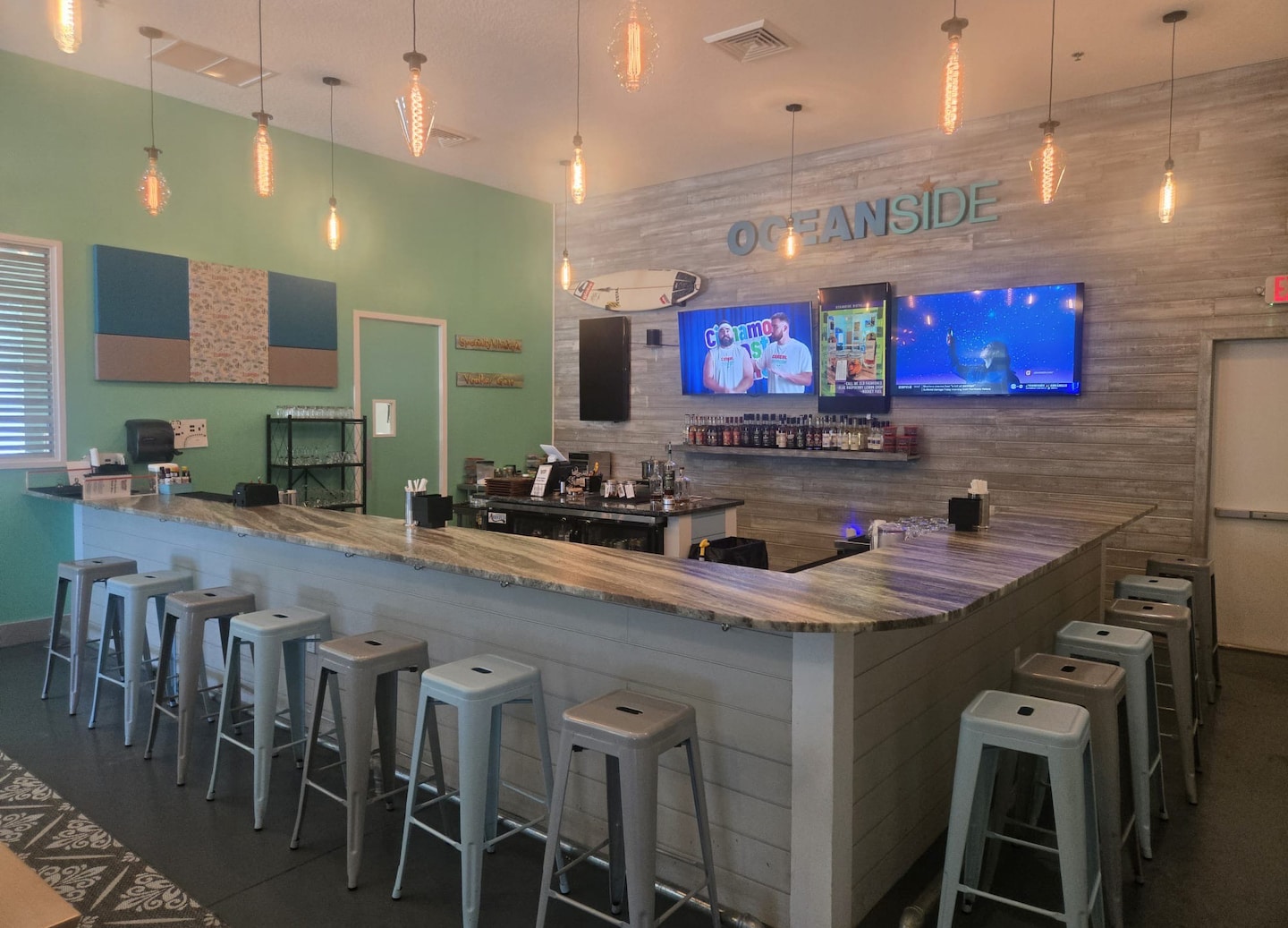 Stools surrounding a bar inside Oceanside Distillery. - Orlando (Port Canaveral), Florida