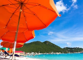 beach umbrellas turquoise water caribbean
