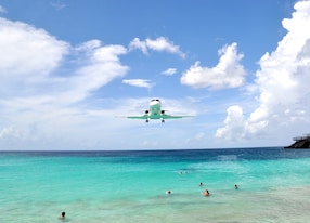 airplane approaches princess juliana airport above