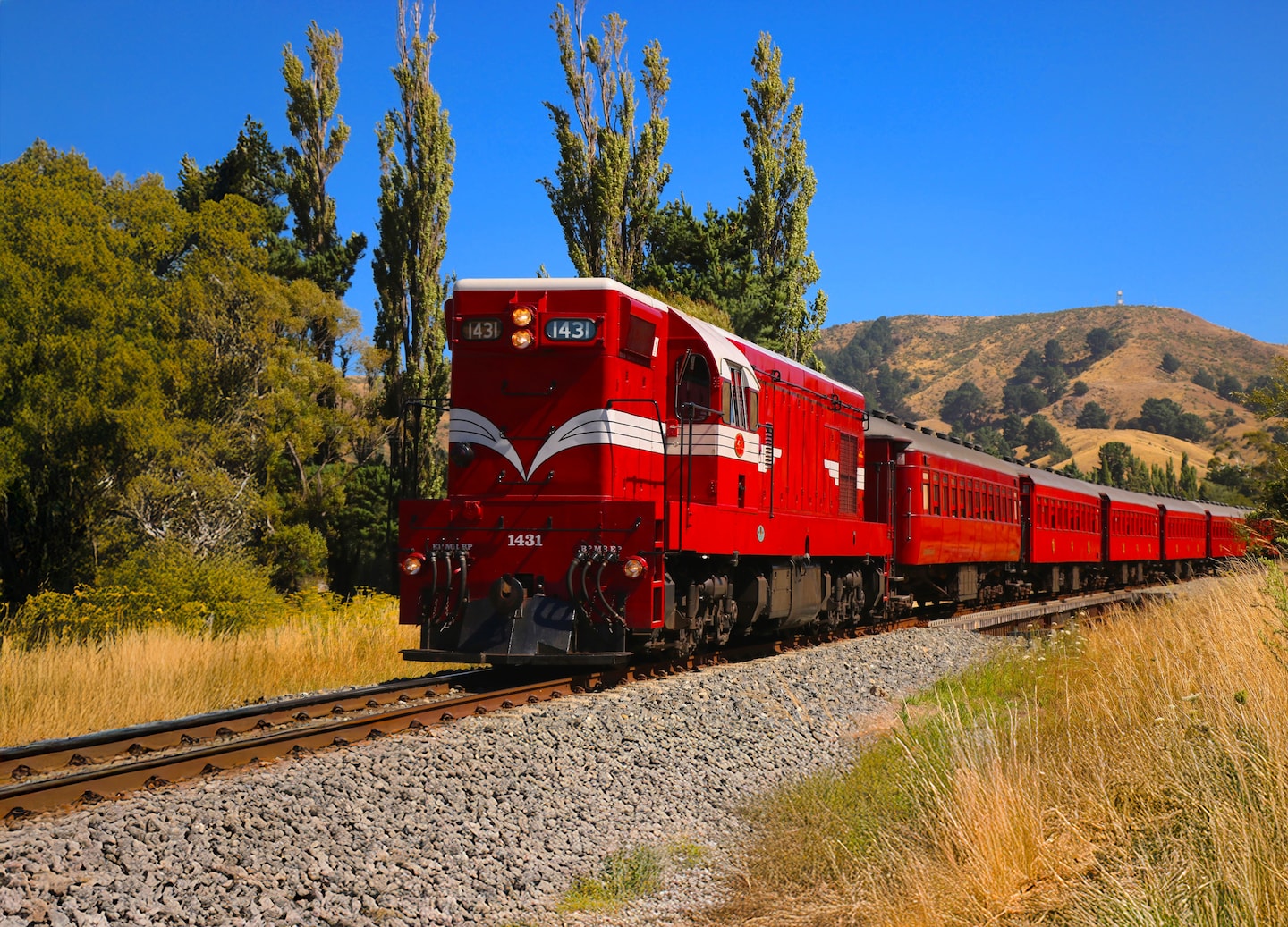 Close-up of Marlborough Flyer steam train with polished red exterior. - Picton, New Zealand