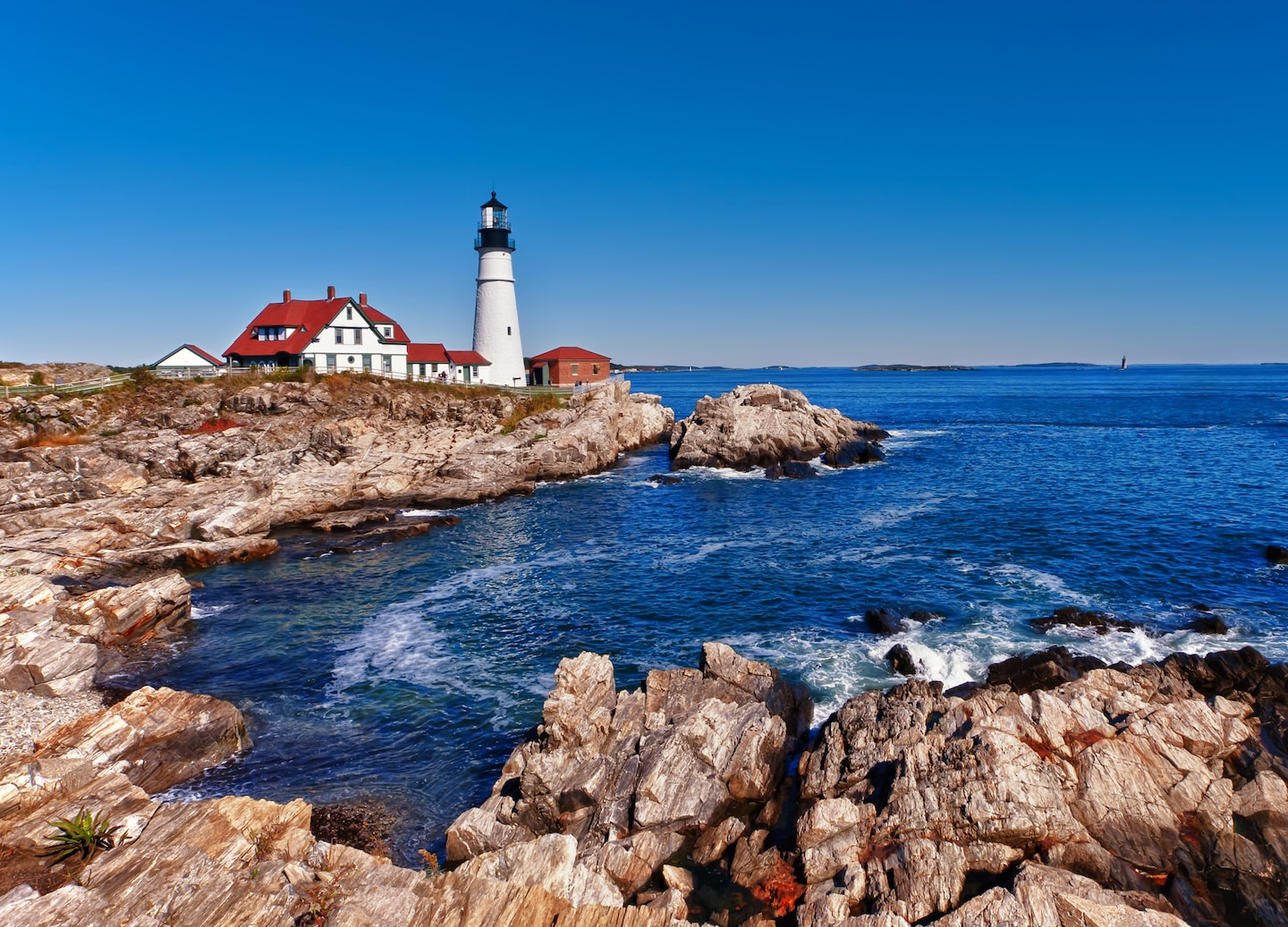 Portland Head Light stands on a rocky Maine shoreline. - Portland, Maine