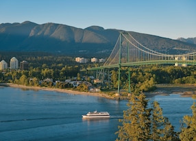 Granville Island and Capilano Suspension Bridge Treetops Adventure Boat Passing Lions Bridge