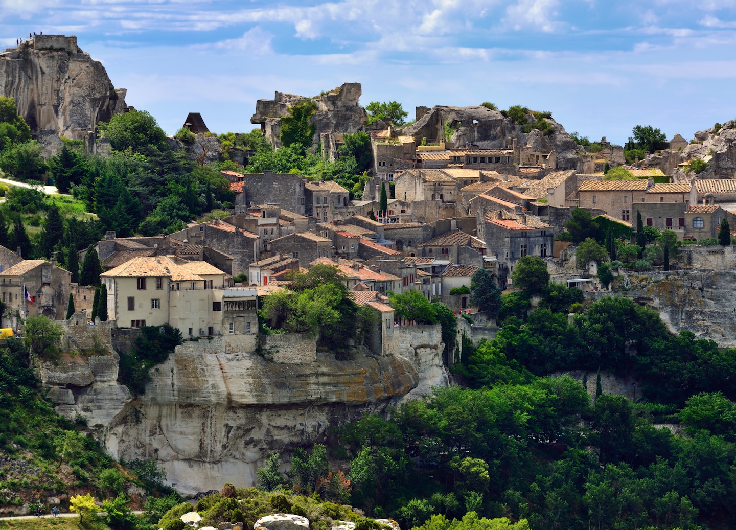 Les Baux‑de‑Provence’s stone village and hilltop castle rise dramatically above the rocky landscape. - Provence (Marseille), France