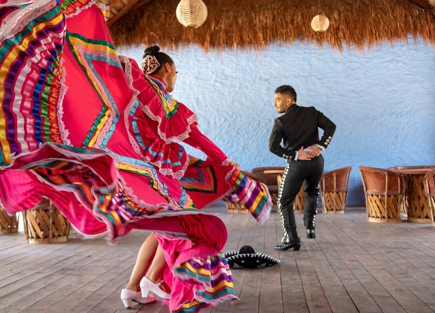 Garifuna dancers perform in traditional attire, moving rhythmically during a cultural celebration in Mahahual. - Puerto Costa Maya, Mexico
