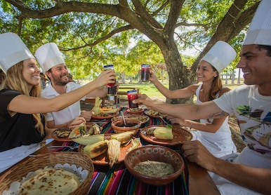 Small Group Pueblos Culinary Experience guests eating outside picnic