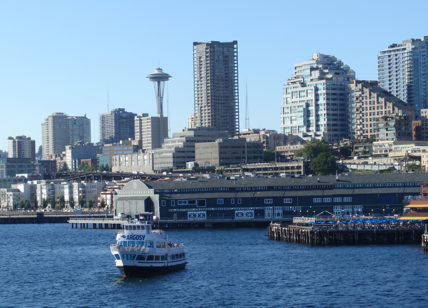 Downtown Seattle waterfront with boats, piers, and city skyline. - Seattle, Washington