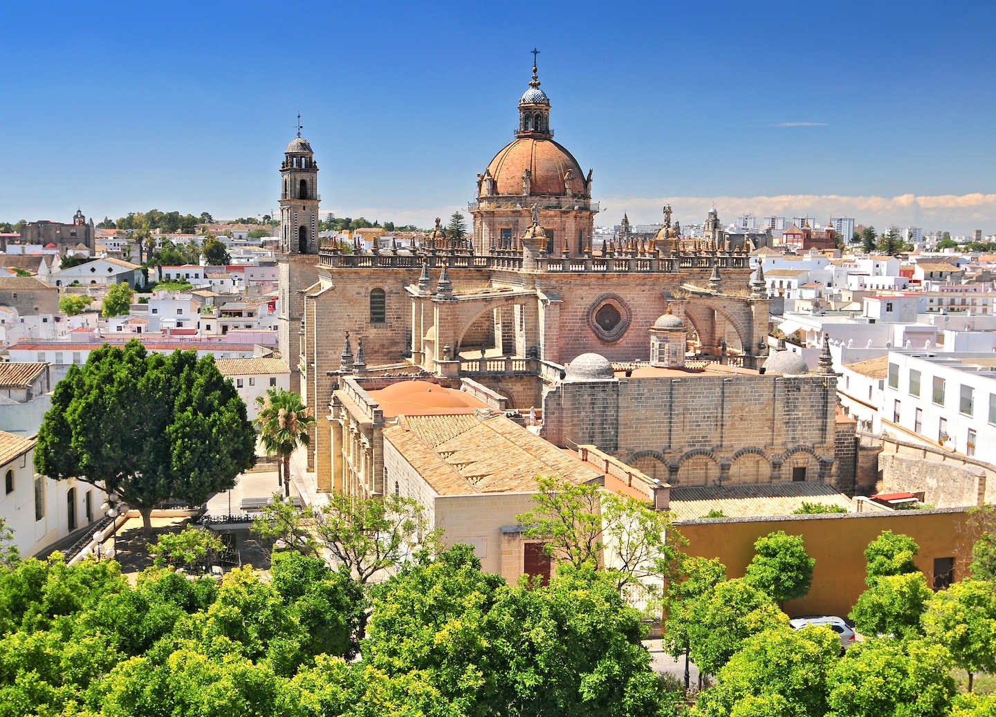 Spring brings warm sun, blooming orange trees and vibrant celebrations like Semana Santa and Feria de Abril. - Seville, Spain