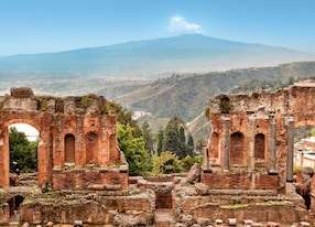 roman theater of taormina etna volcano in the background sicily italy