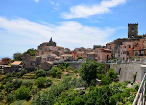panoramic view of the medieval mountain village of forza d agro in sicily a sunny day in summer