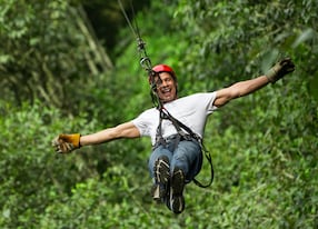 adult man on zip line forest