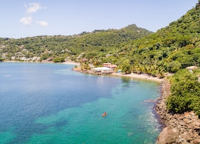 aerial kayak blue waters ocean mountain coastline