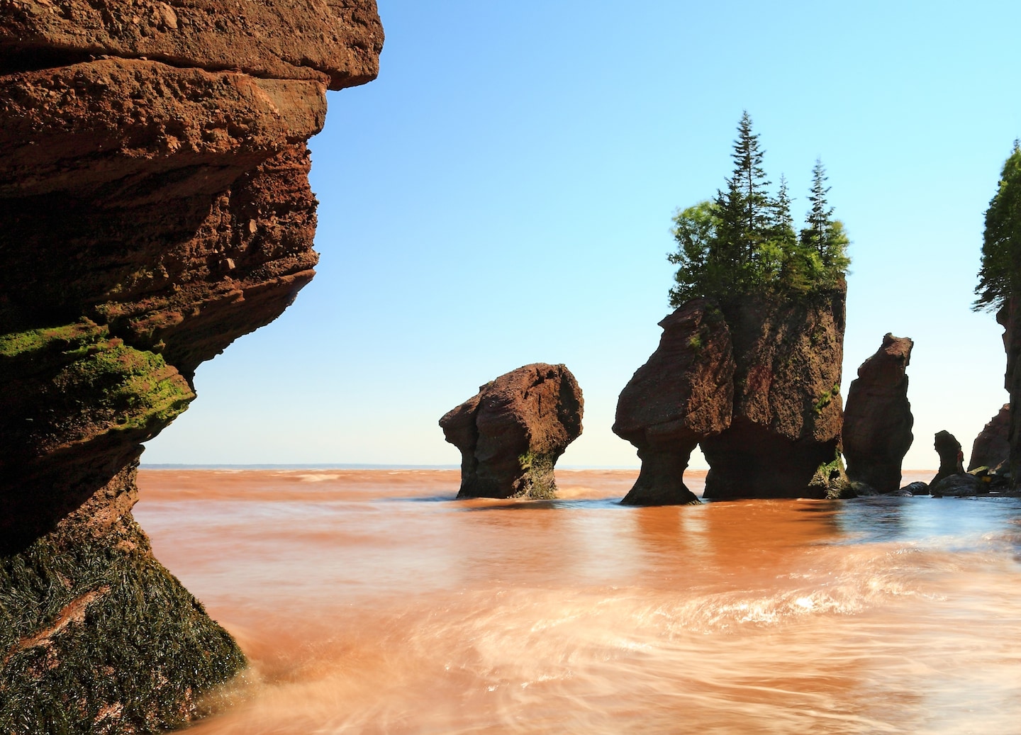 Towering sandstone formations at Hopewell Rocks rise above the Bay of Fundy’s dramatic tidal shoreline. - Saint John (Bay of Fundy), New Brunswick