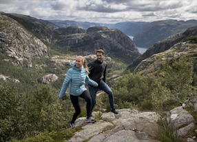 couple hiking mountains rocks trail
