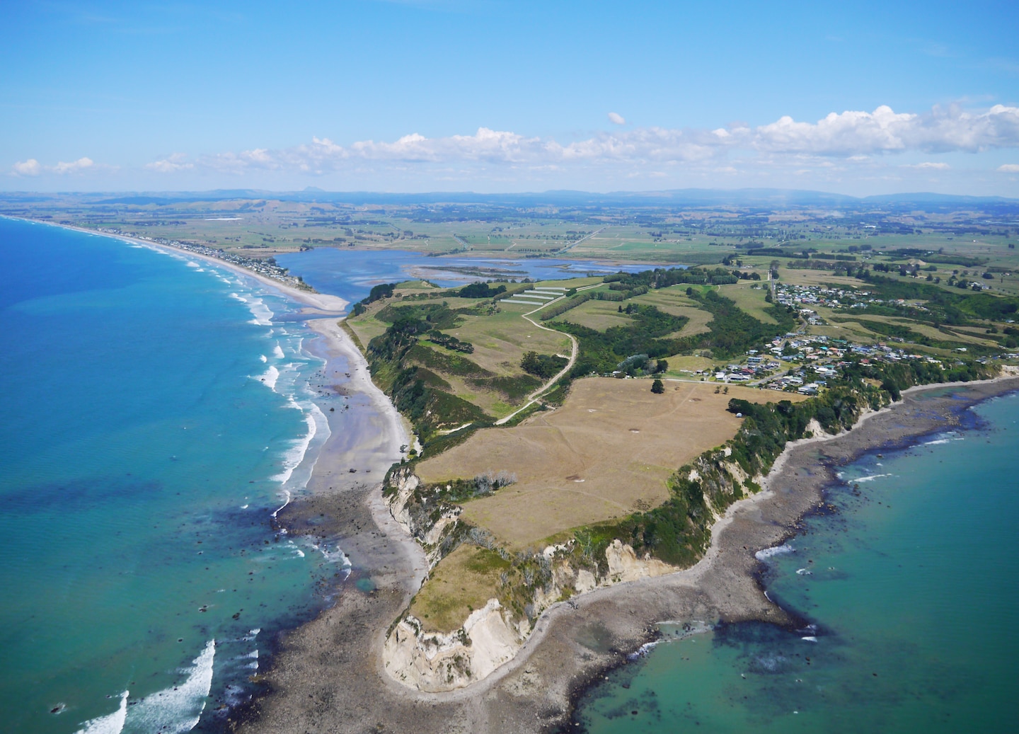 Visit Maketu for bay views, then tour a local orchard to taste fresh produce. - Tauranga, New Zealand