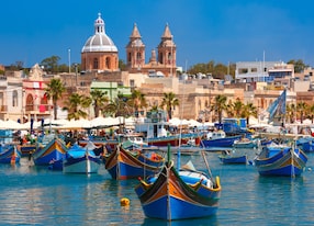 traditional eyed colorful boats luzzu in the harbor of mediterranean fishing village marsaxlokk