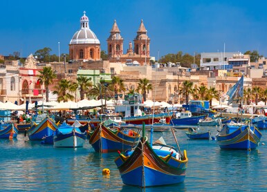 traditional eyed colorful boats luzzu in the harbor of mediterranean fishing village marsaxlokk
