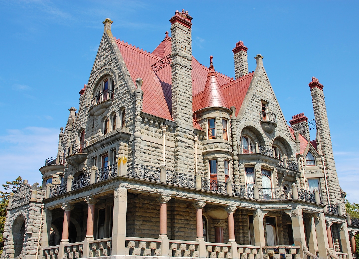 Craigdarroch Castle’s stone towers rise above Victoria’s hillside, showcasing detailed Victorian architecture. - Victoria, British Columbia