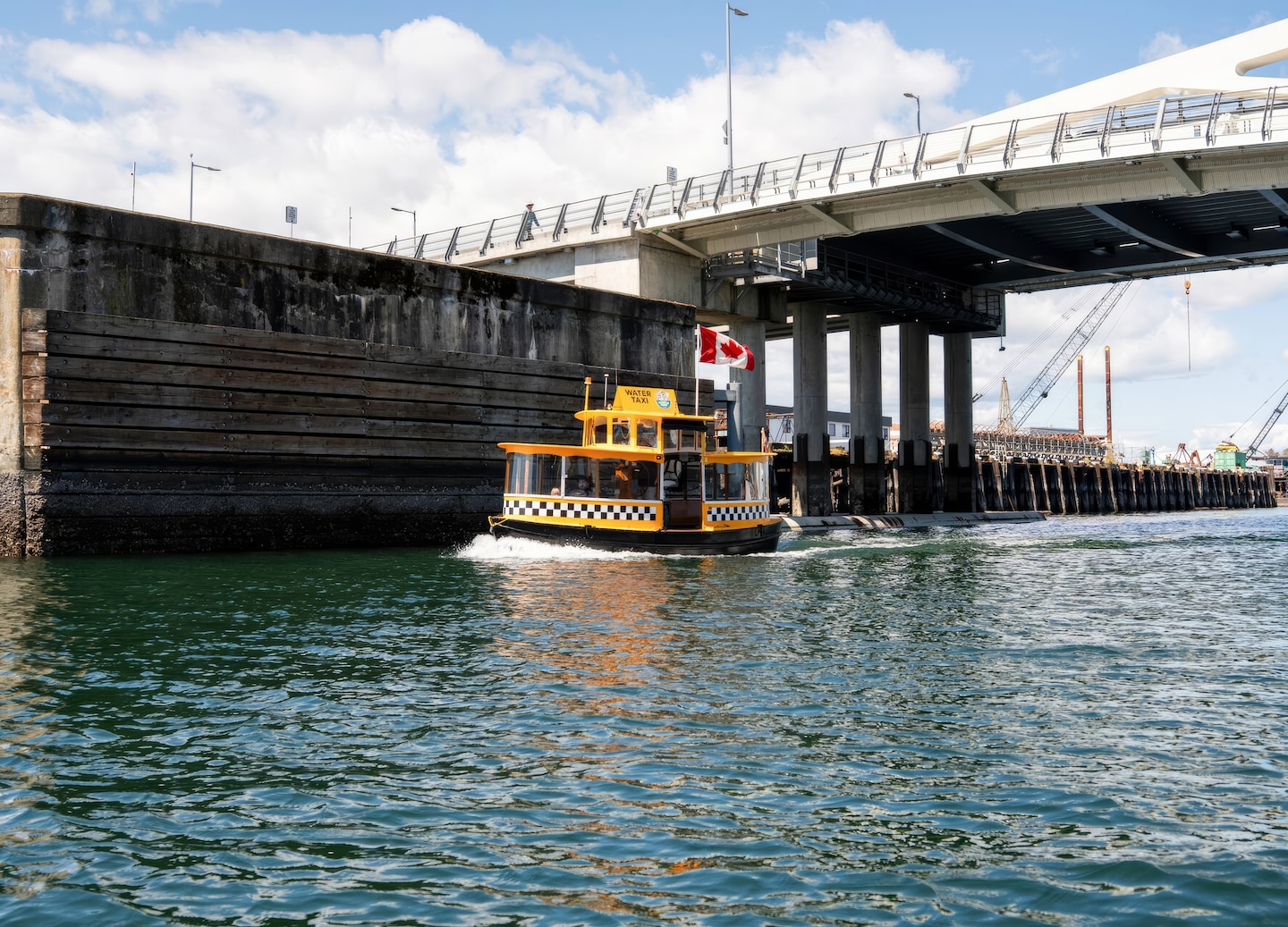 Small harbor ferry crossing calm water near Victoria waterfront. - Victoria, British Columbia