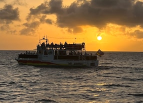 caracas bay cruise we jammin boat sunset