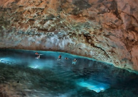 blue water cave snorkel swim rock formations